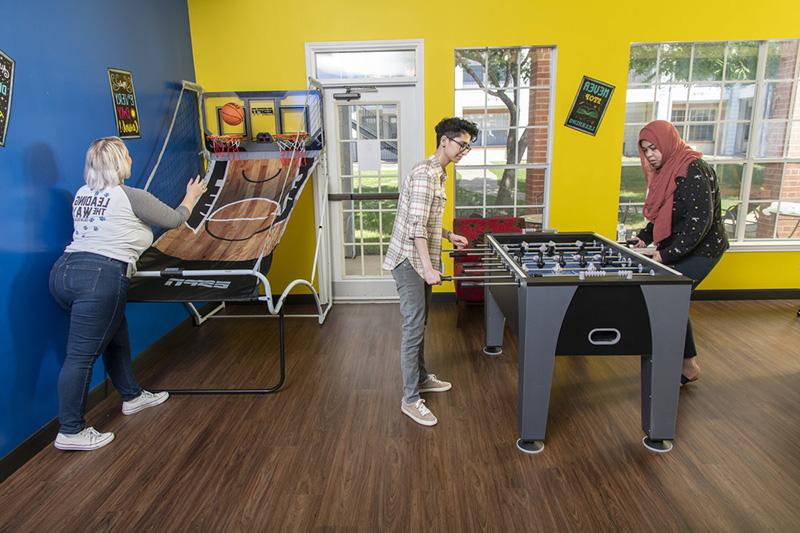 Residents playing fooseball in Student Housing